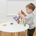 PL087-forest-stacker-boy-putting-animals-in-cotton-bag.jpg